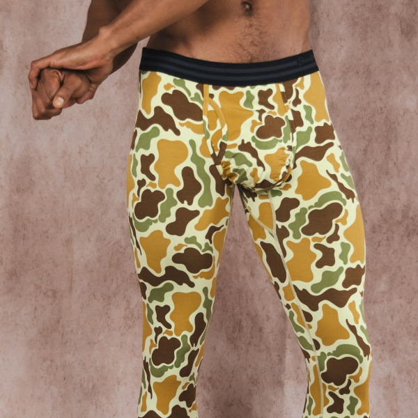 Tan duck-camo Shinesty long johns with a black waistband, legs running all the way to the ankle