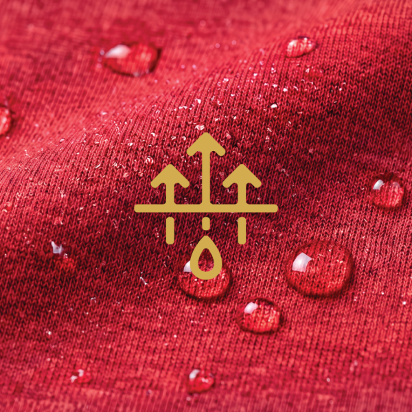 Water droplets beading on red MicroModal fabric next to a gold moisture-wicking symbol