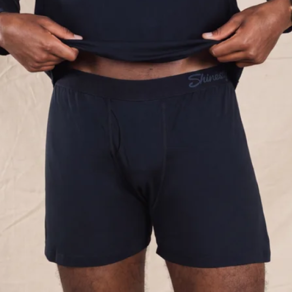 Shirt lifted to reveal loose navy Shinesty boxer shorts with a logo waistband and no pouch up front