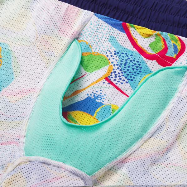 Bright 80s abstract swim trunk liner flipped inside out around a mint mesh Ball Hammock pouch