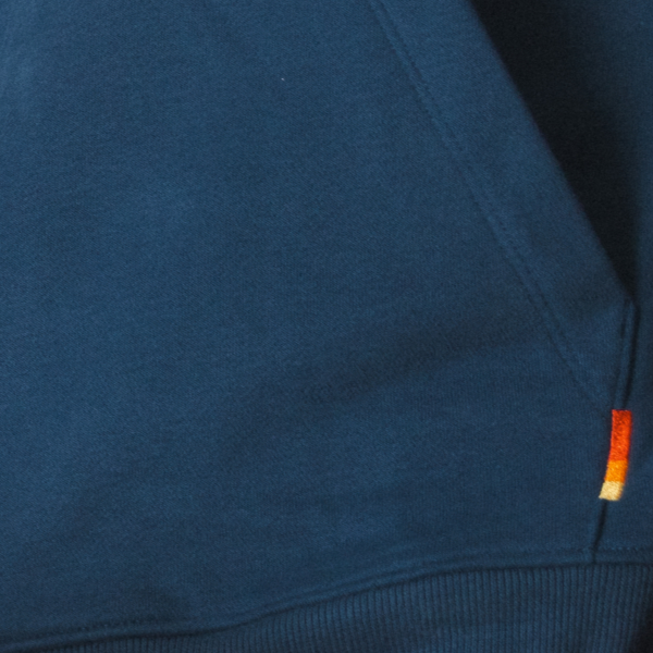 French terry in navy with a small striped Shinesty tag at the seam, ribbed hem below
