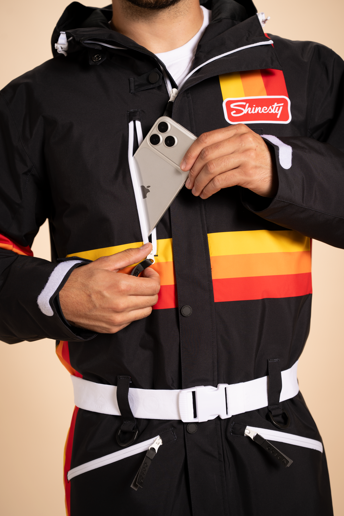 The T-Bar Trooper | Black and Orange Retro Stripe One Piece Ski Suit - Shinesty