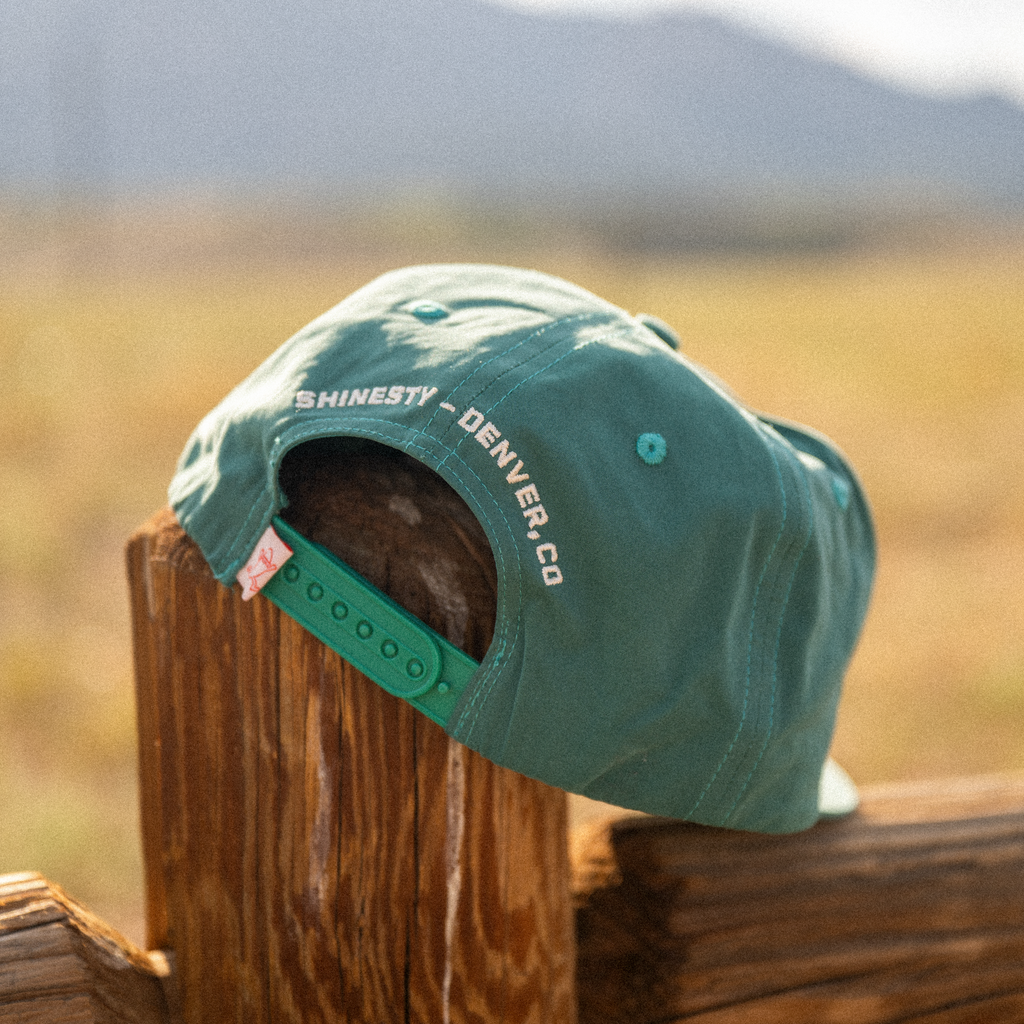 The Liar | Green Colorado Sucks Trucker Hat - Shinesty