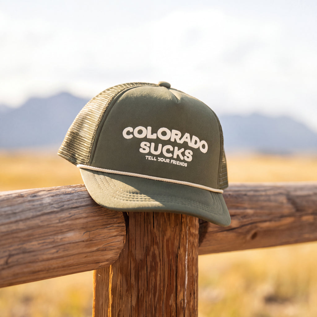 The Liar | Green Colorado Sucks Trucker Hat - Shinesty